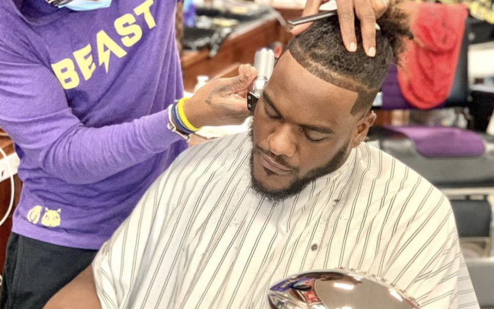 DeJuan cuts Frank Clark's hair