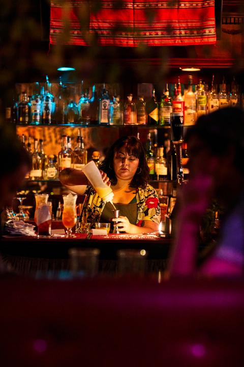 Diana Condori Mixing Cocktails