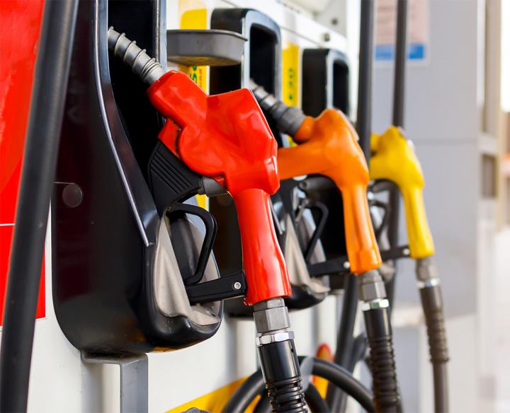 Gas pump with red, orange and yellow pumps