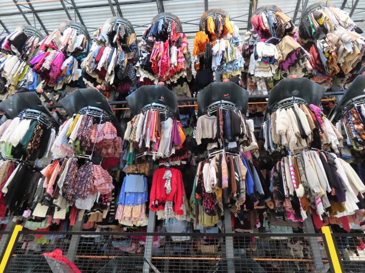 Stacks of clothes hanging 